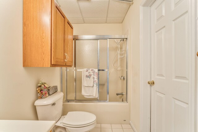 815 Battlefield Park Dr, Dalton, GA 30720 - bathroom featuring enclosed tub / shower combo, a paneled ceiling, tile patterned floors, and toilet