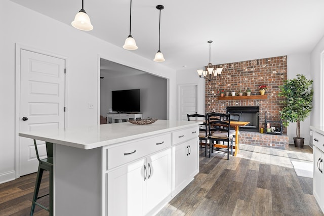 4700 Creek Point Ln, Signal Mountain, TN 37377 - kitchen with dark wood-style flooring, white cabinets, light countertops, a center island, and open floor plan