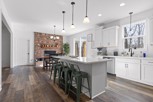 4700 Creek Point Ln, Signal Mountain, TN 37377 - kitchen featuring dishwasher, dark wood-type flooring, light countertops, a chandelier, and white cabinets