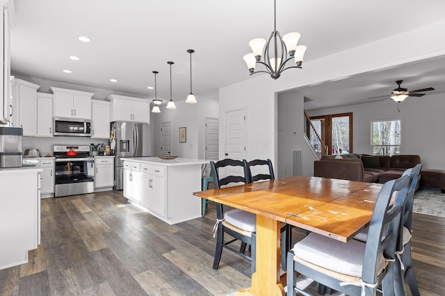4700 Creek Point Ln, Signal Mountain, TN 37377 - dining space featuring dark wood-style flooring, recessed lighting, ceiling fan, and a chandelier