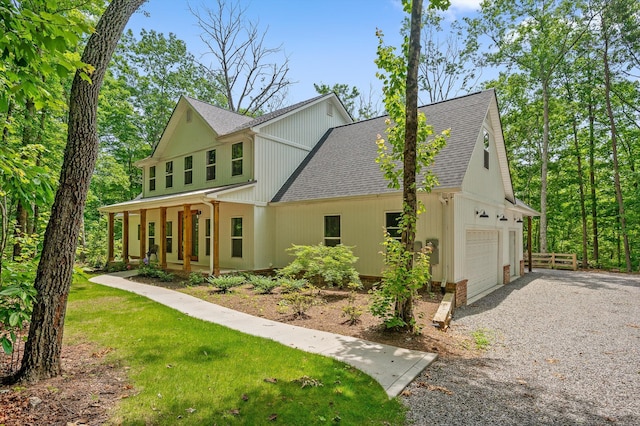 4700 Creek Point Ln, Signal Mountain, TN 37377 - modern farmhouse featuring roof with shingles, a porch, gravel driveway, and an attached garage