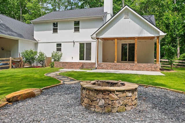 4700 Creek Point Ln, Signal Mountain, TN 37377 - back of property featuring a fire pit, a chimney, a shingled roof, and a patio area