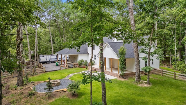 4700 Creek Point Ln, Signal Mountain, TN 37377 - rear view of property with a shingled roof, a fire pit, a fenced backyard, and a patio