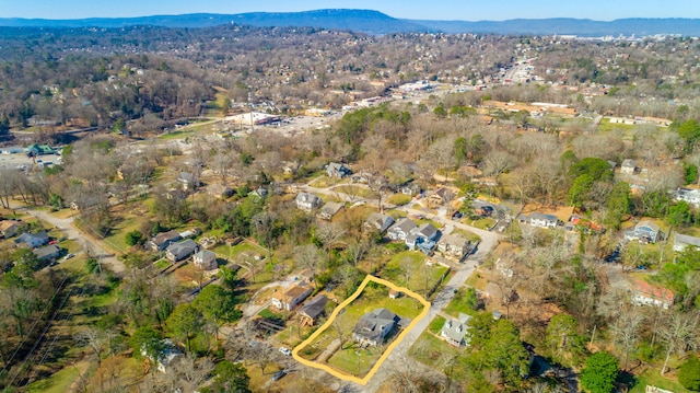 drone / aerial view featuring a residential view and a mountain view