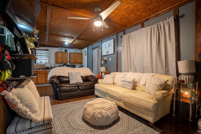 living room featuring ceiling fan and wood-type flooring