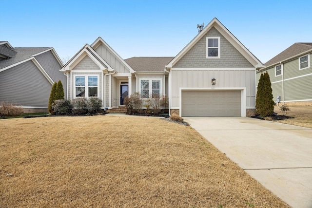 craftsman house with a garage and a front yard