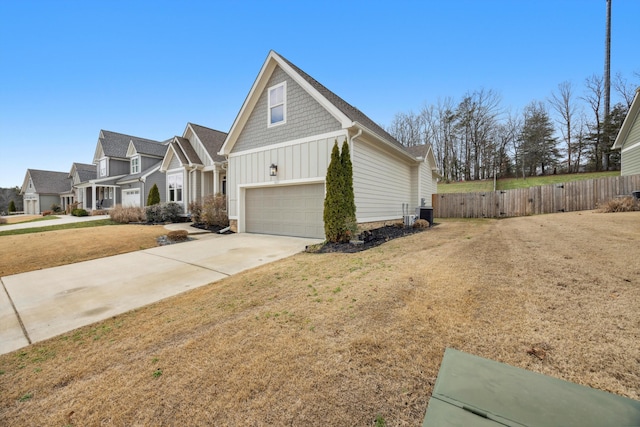 view of property exterior with a garage and a lawn