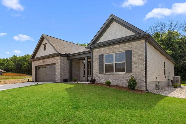 8918 Knolling Lp Unit 32, Ooltewah, TN 37363 - craftsman-style home featuring a front lawn, driveway, an attached garage, and brick siding