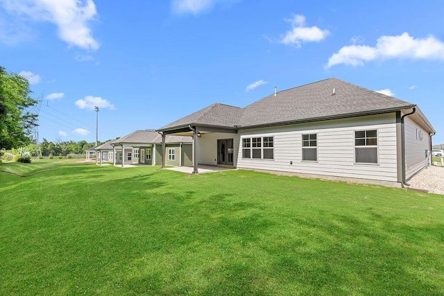 8918 Knolling Lp Unit 32, Ooltewah, TN 37363 - rear view of house featuring a patio, a yard, and a shingled roof