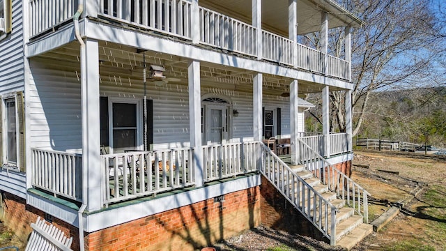 view of exterior entry with covered porch