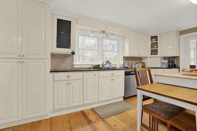 kitchen featuring tasteful backsplash, dishwasher, sink, white cabinets, and light wood-type flooring