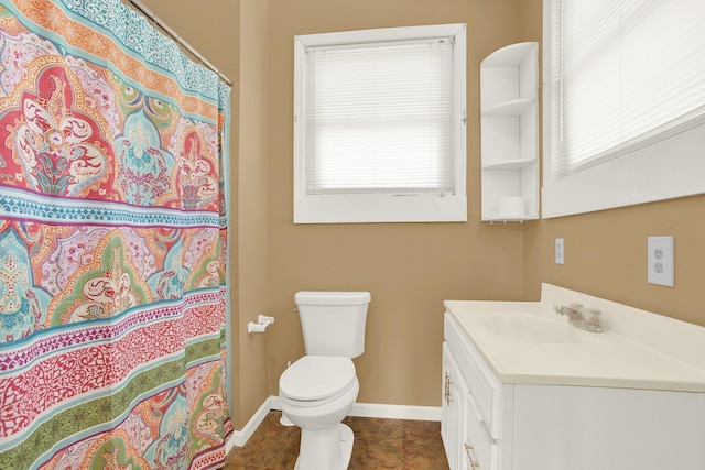 bathroom with tile patterned flooring, vanity, curtained shower, and toilet