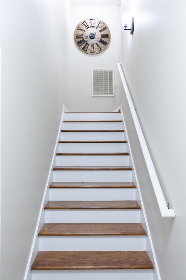 staircase featuring visible vents