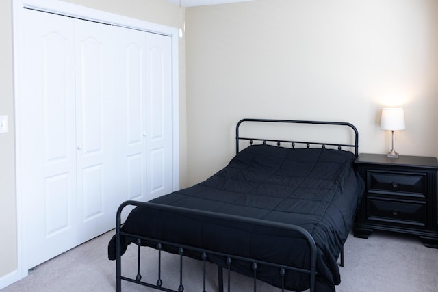 carpeted bedroom featuring a closet