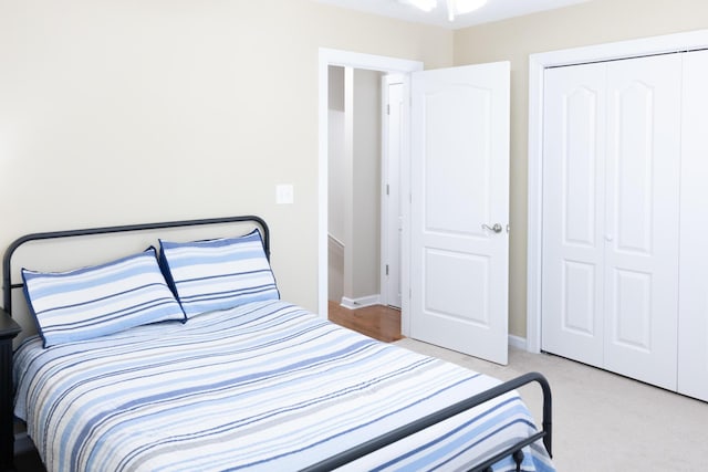 bedroom with a closet and baseboards