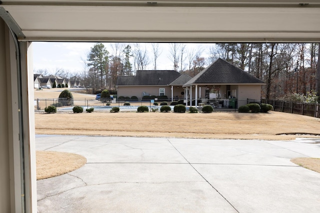 view of yard with fence and a patio