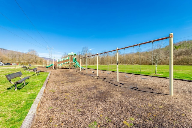 communal playground with a lawn