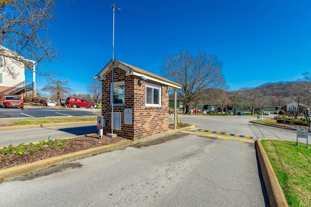 view of street featuring a residential view and curbs