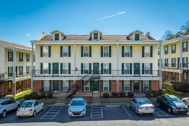 view of property with uncovered parking