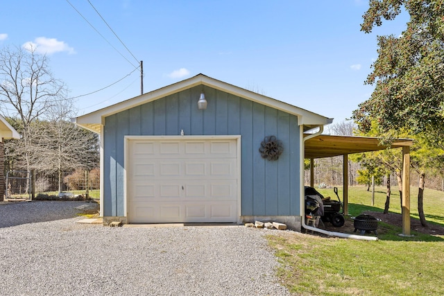 detached garage featuring driveway