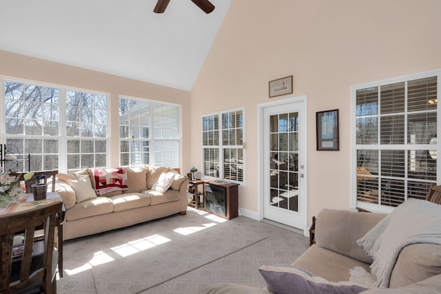 sunroom / solarium with vaulted ceiling and a ceiling fan