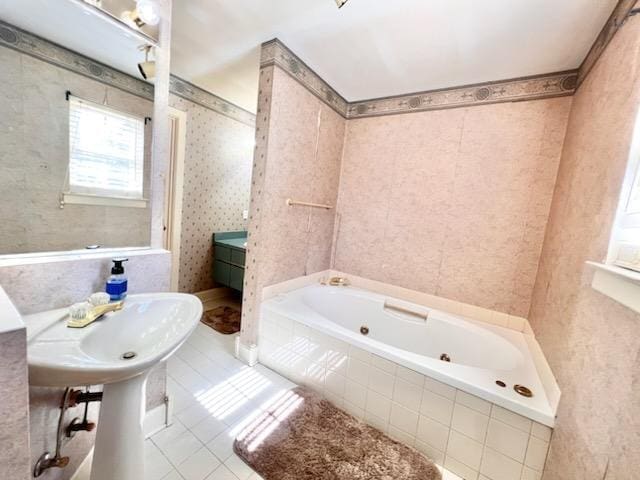 full bath featuring tile patterned flooring, a tub with jets, and wallpapered walls