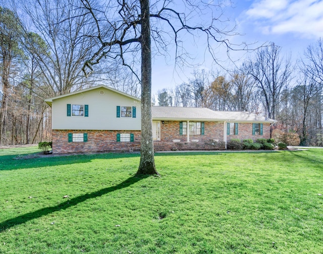 tri-level home with a front yard