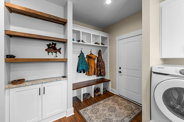 interior space featuring dark hardwood / wood-style flooring and washer / dryer