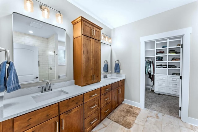 bathroom featuring vanity and a shower with door