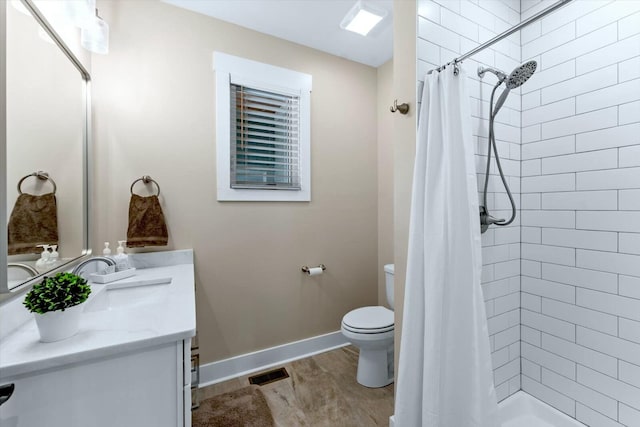 bathroom with toilet, hardwood / wood-style flooring, curtained shower, and vanity