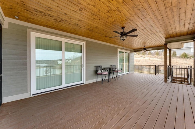 wooden deck featuring ceiling fan