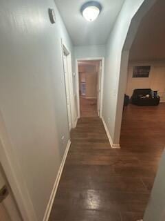 hallway with dark hardwood / wood-style flooring