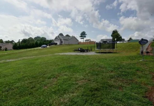 view of yard featuring a trampoline