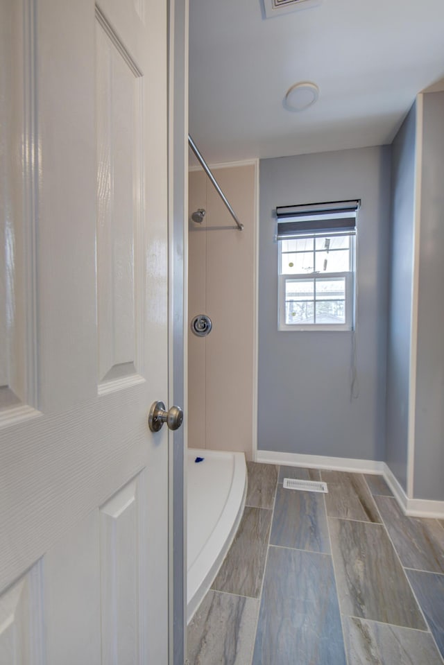 bathroom featuring walk in shower