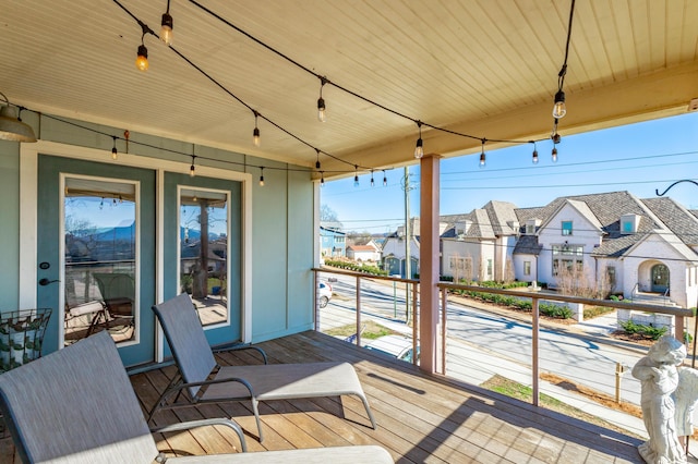 wooden deck featuring a residential view