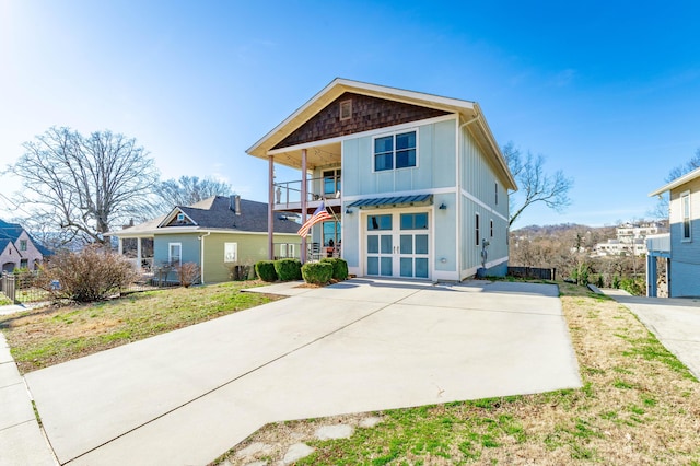 view of front of home with a balcony and board and batten siding