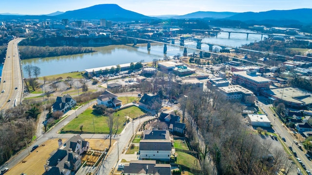 birds eye view of property with a water and mountain view