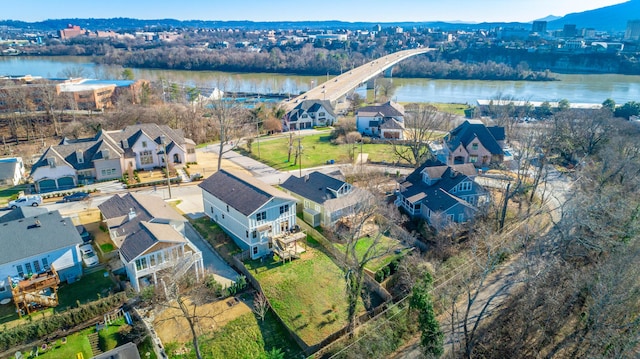 birds eye view of property with a residential view and a water view