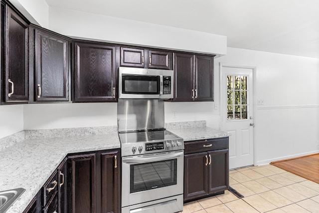 kitchen featuring dark brown cabinets and appliances with stainless steel finishes