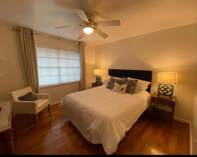 bedroom featuring a ceiling fan, dark wood finished floors, and baseboards