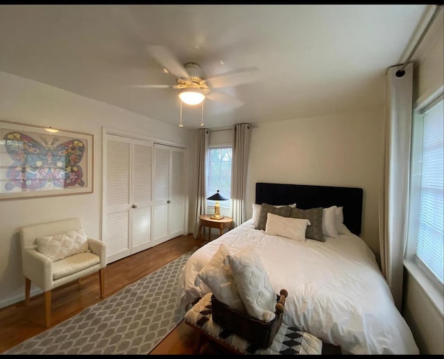 bedroom featuring a closet, wood finished floors, and a ceiling fan