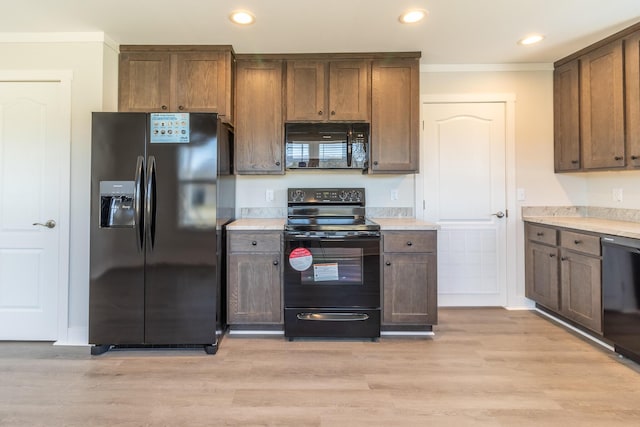 79 Bear Oak Dr, Dunlap, TN 37327 - kitchen with black appliances, light countertops, light wood-style floors, recessed lighting, and crown molding