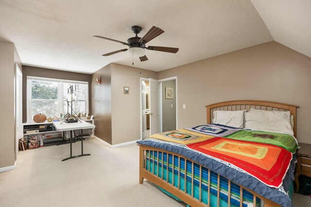 bedroom featuring light carpet, ceiling fan, a textured ceiling, and baseboards