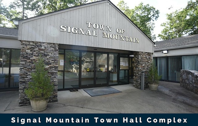 entrance to property with stone siding