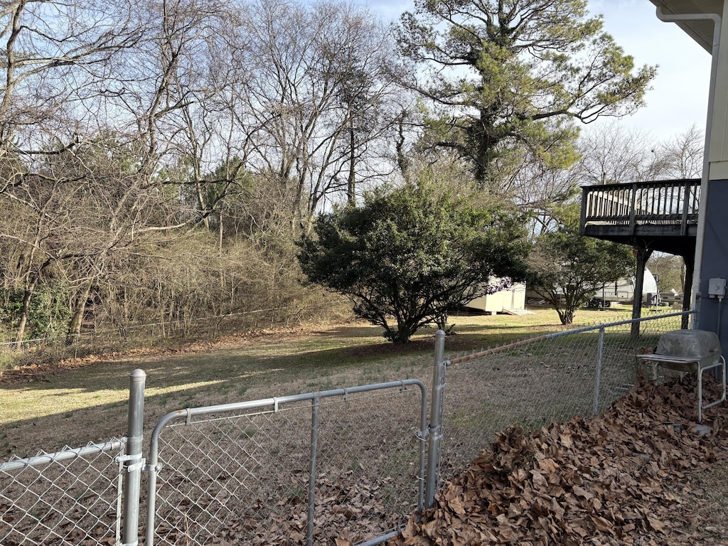 view of yard featuring a wooden deck