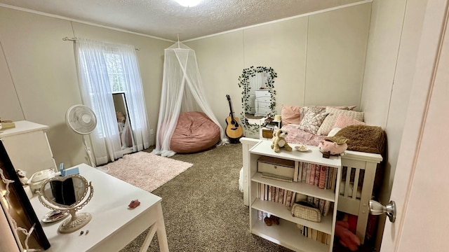 recreation room with a textured ceiling and carpet flooring