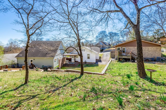 view of yard with a deck, cooling unit, and a residential view