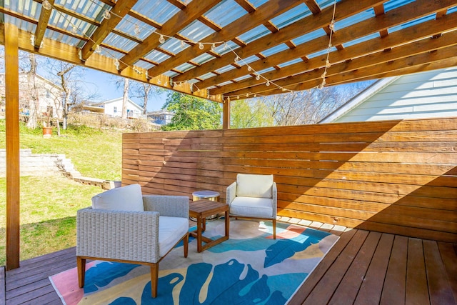 wooden terrace with a lawn and a pergola