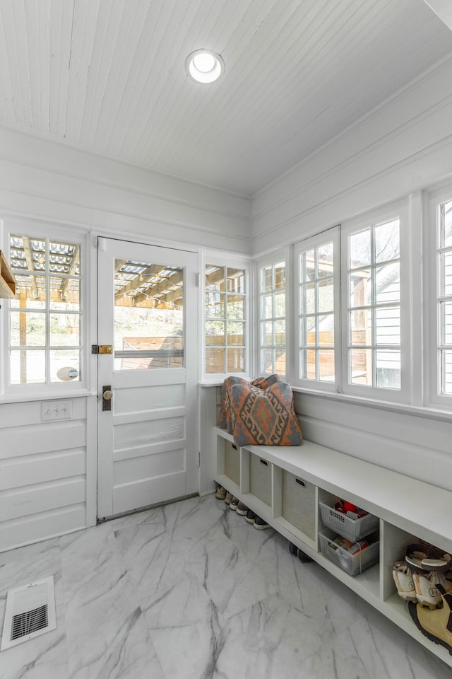 sunroom featuring wood ceiling and visible vents