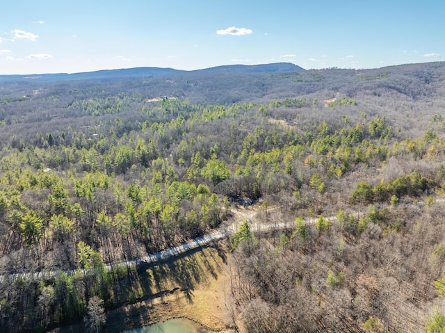 birds eye view of property with a view of trees and a mountain view